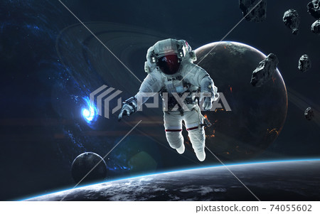 Astronaut in deep space, beauty of endless cosmos. Science fiction wallpaper. Elements of this image furnished by NASA Astronaut in deep space, beauty of endless cosmos. Science fiction wallpaper. Elements of this image furnished by NASA 74055602