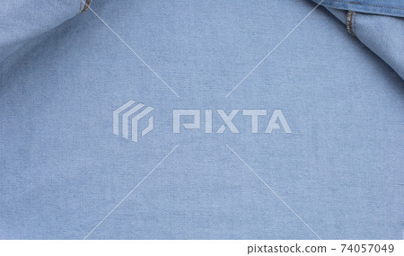 Close up jeans shirt texture. Close up jeans shirt texture. 74057049