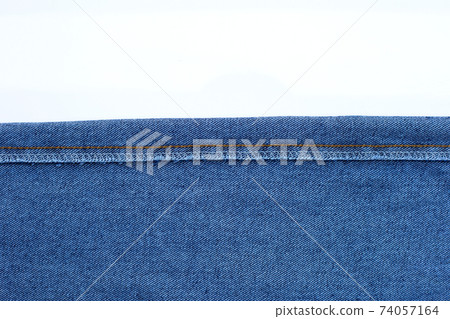 Texture of blue jeans on white Texture of blue jeans on white 74057164
