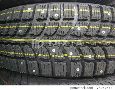 winter studded tires for a car new close-up winter studded tires for a car new close-up 74057658