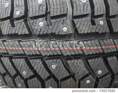 winter studded tires for a car new close-up winter studded tires for a car new close-up 74057680