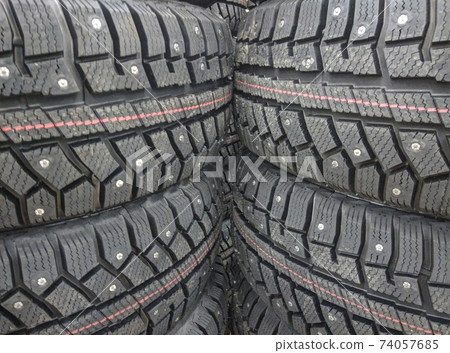 winter studded tires for a car new close-up winter studded tires for a car new close-up 74057685