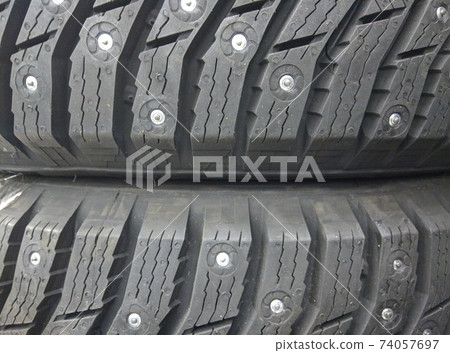 winter studded tires for a car new close-up 74057697