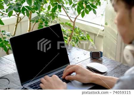 Image of working on a personal computer Image of working on a personal computer 74059315