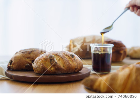 Bread and maple syrup Bread and maple syrup 74060856