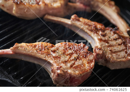 Bake lamb chops in a grill pan Bake lamb chops in a grill pan 74061625
