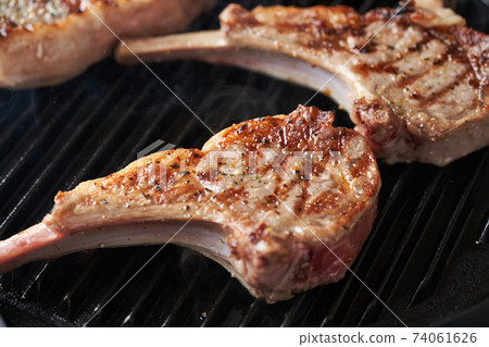 Bake lamb chops in a grill pan Bake lamb chops in a grill pan 74061626