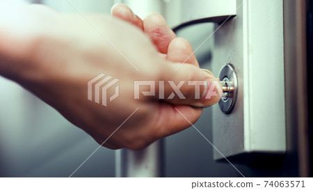 Men's hand opening the door 74063571