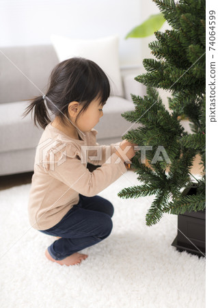 Girls decorating Christmas Girls decorating Christmas 74064599