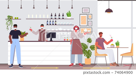 visitors in protective masks keeping distance to prevent coronavirus social distancing concept cafe interior visitors in protective masks keeping distance to prevent coronavirus social distancing concept cafe interior 74064900