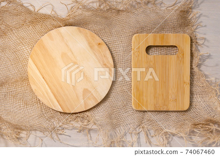 empty wooden cutting boards on a light background with space for copying text. flat lay empty wooden cutting boards on a light background with space for copying text. flat lay 74067460