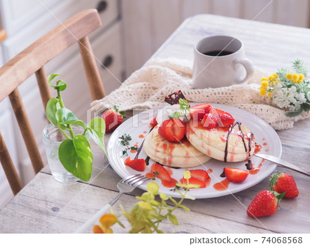 Spring sweets Tea time with strawberry pancakes 74068568