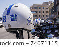 Police motorcycles and helmets ready for departure 74071115