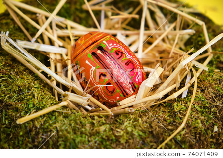 easter basket with easter eggs on Yellow background 74071409