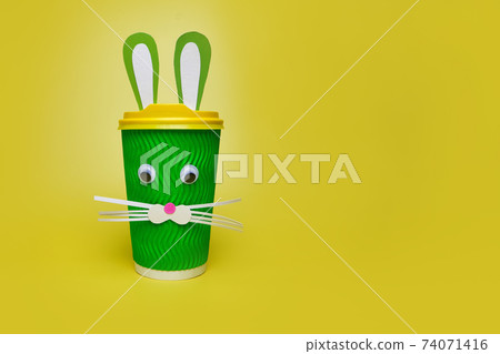 cardboard cup of coffee, with ears and a rabbit face 74071416