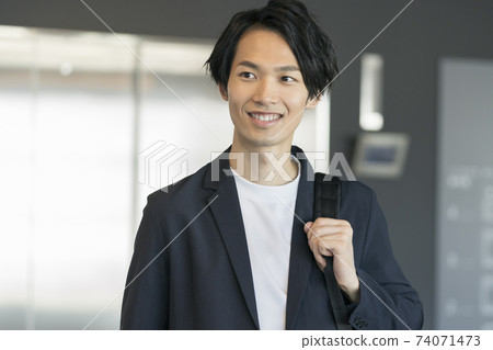 Image of a young businessman with a smile 74071473