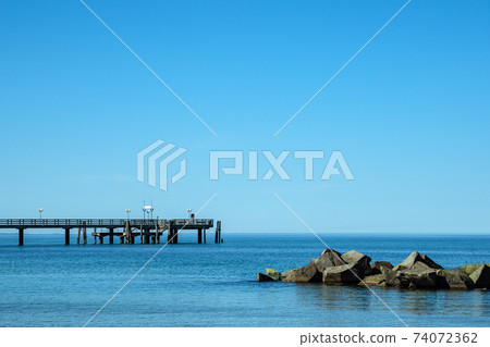 Pier on the Baltic Sea coast in Wustrow, Germany Pier on the Baltic Sea coast in Wustrow, Germany 74072362