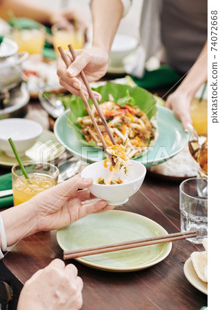 Housewife serving salad 74072668