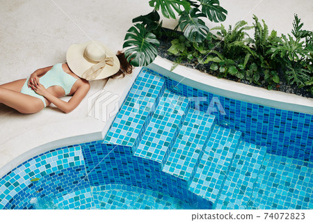 Beautiful sunbathing woman 74072823