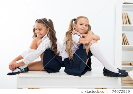 School break concept. Schoolgirls cute pony tails hairstyle  74072939