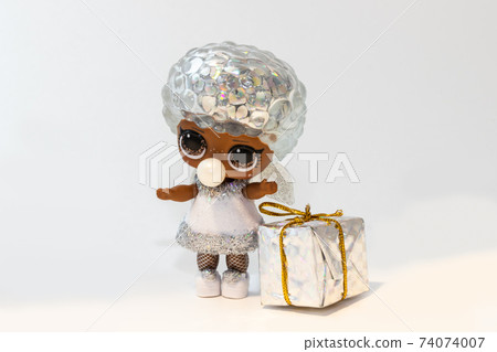 Kouvola, Finland - 25 January 2020: Silver colored beautiful L.O.L. surprise doll with gift box Kouvola, Finland - 25 January 2020: Silver colored beautiful L.O.L. surprise doll with gift box 74074007