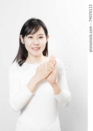 Woman disinfecting hands with alcohol Woman disinfecting hands with alcohol 74078113