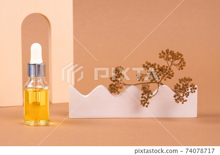 Mockup image of dropper bottle of organic cosmetics - polyglutamic or hyaluronic acid, serum, moisturizer or facial anti-aging oil. Essential oil in trendy neutral biege still life composition Mockup image of dropper bottle of organic cosmetics - polyglutamic or hyaluronic acid, serum, moisturizer or facial anti-aging oil. Essential oil in trendy neutral biege still life composition 74078717