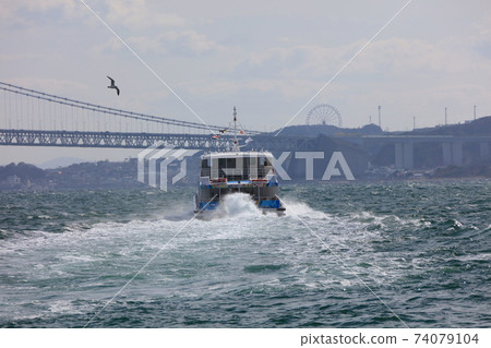 Awaji Jenova Line and Akashi Kaikyo Bridge departing from Akashi Fishing Port 74079104