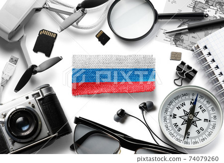 Flag of Russia and travel accessories on a white background. 74079260