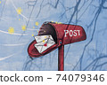 Green mail box on the wall 74079346