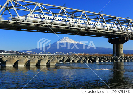 Shinkansen crossing the Fuji River and Mt. Fuji 74079378