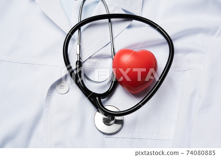 medical stethoscope and red rubber heart on a white background medical stethoscope and red rubber heart on a white background 74080885