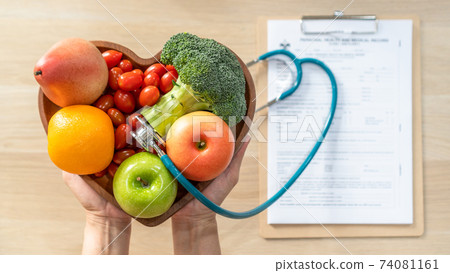 Nutritional food for heart health wellness by cholesterol diet and healthy nutrition eating with clean fruits and vegetables in heart dish by nutritionist and doctor recommended for patient well-being Nutritional food for heart health wellness by cholesterol diet and healthy nutrition eating with clean fruits and vegetables in heart dish by nutritionist and doctor recommended for patient well-being 74081161