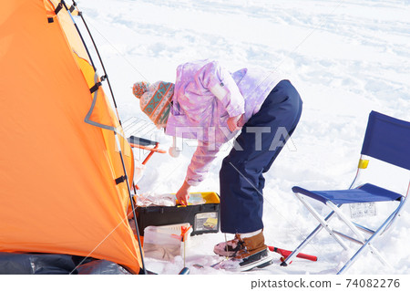 Girl smelt fishing 74082276