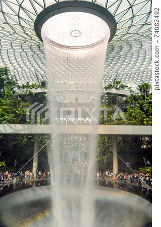 SINGAPORE - December 22, 2019: The largest indoor waterfall inside Jewel Changi Airport in Singapore SINGAPORE - December 22, 2019: The largest indoor waterfall inside Jewel Changi Airport in Singapore 74082492