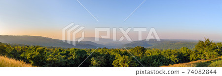 Panorama of landscape mountains valley during the sunset. Natural outdoor background concept Panorama of landscape mountains valley during the sunset. Natural outdoor background concept 74082844