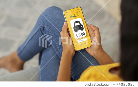 Best mobile taxi app. Unrecognizable black woman using modern application, ordering cab on phone, paying for service 74083053