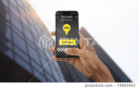 Closeup view of black guy holding smartphone with taxi app interface, ordering cab on city street, panorama 74083491