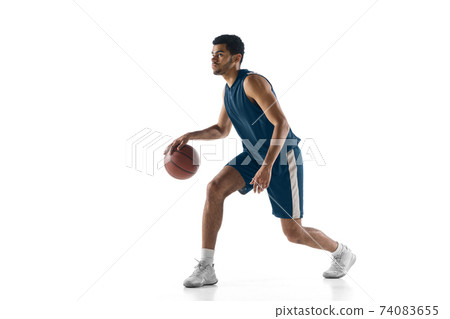 Young arabian basketball player of team in action, motion isolated on white background. Concept of sport, movement, energy and dynamic. Young arabian basketball player of team in action, motion isolated on white background. Concept of sport, movement, energy and dynamic. 74083655