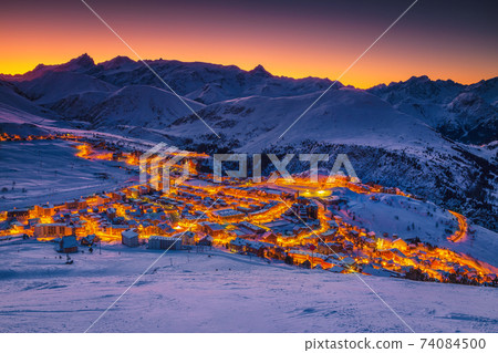 Breathtaking ski slopes and resort at dawn, Rhone Alps, France Breathtaking ski slopes and resort at dawn, Rhone Alps, France 74084500