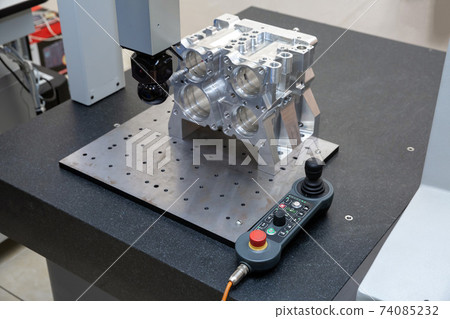 The coordinate measuring machine measures the aluminum part turned by the cnc machine 74085232