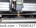 Programmable machine for laser cutting of metal. Sparks from laser cutting, 74085427