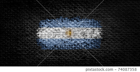 National flag of the Argentina on dark fabric 74087358