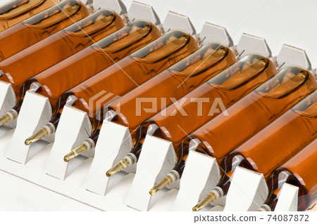Ampoules isolated on white. Ampoules isolated on white. 74087872