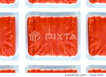Crab sticks vacuum packed. Crab sticks from the store on a white background. 74087960
