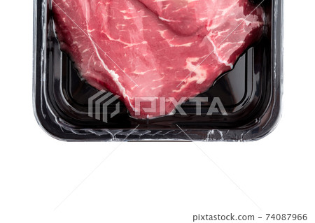 Vacuum-packed beef on a white background. Marbled beef from the store isolated on a white background. Vacuum-packed beef on a white background. Marbled beef from the store isolated on a white background. 74087966