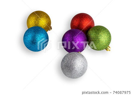 Christmas balls isolated on white background. Several christmas balls close-up on a white background. 74087975