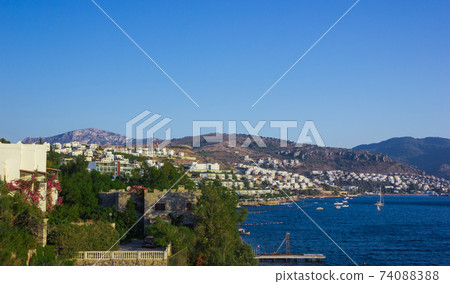 View of the Gumbet Bay. Mountainous terrain near the Aegean Sea. Typical buildings on the mountain near the sea. Bodrum. Turkey. 74088388