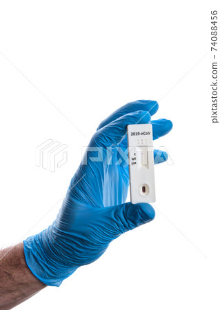 Doctor shows rapid laboratory COVID-19 test for detection of IgM and IgG antibodies to Novel Coronavirus, worldwide pandemics concept. Doctor shows rapid laboratory COVID-19 test for detection of IgM and IgG antibodies to Novel Coronavirus, worldwide pandemics concept. 74088456