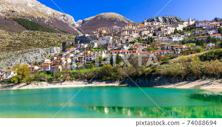 Pictorial emerald lake - Lago di Barrea and medieval village in Abruzzo, Italy 74088694